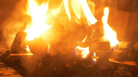 Blacksmithing: starting the coal forge in UHD Stockbeeldmateriaal 91803565