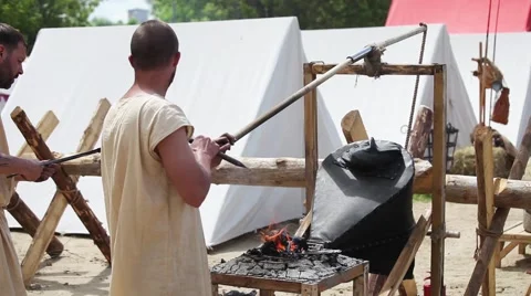 Blacksmith's assistant working with bellows Stock Footage 61092185