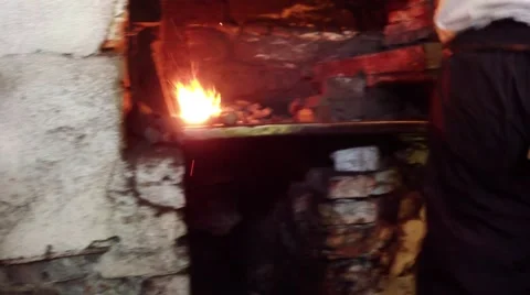 Blacksmiths forge metal in an old blacksmith working on a water-powered Stock Footage 46450080