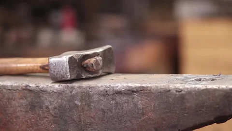 Blacksmiths hammer resting on anvil Stock Footage 133954340