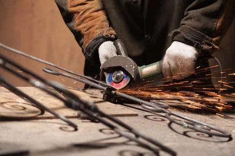 Blacksmith's Hand In Protective Gloves Solder A Metal Stock Photos