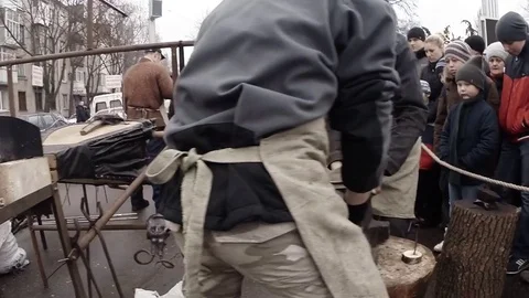 Blacksmiths Interchange Position of Anvil in Square During Holiday Stock Footage 74794230