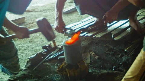 Blacksmiths at work in the forge Stock Footage 40498375