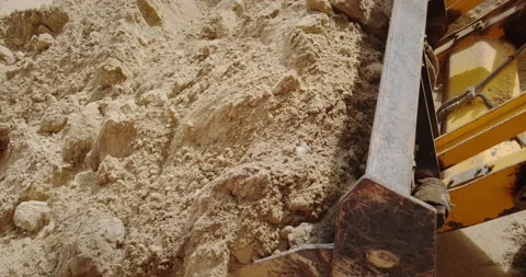 The blade of a bulldozer digging the ground Stock Footage 140233905