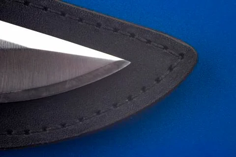 The blade of a knife on a blue background Stock Photos