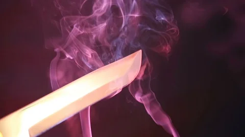 Blade of a knife close-up on a red background. Steel arms, Dagger. Blade clos Stock Footage 93045893