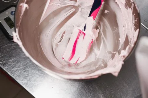 Blade in marshmallow mass lying in a container Stock Photos
