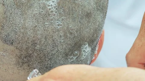 The blade moving from the bottom of the head going to the top. Stock Footage 306994419