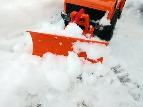 A blade pushes the snow Фото