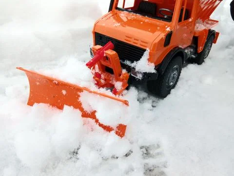 A blade pushes the snow Stock-Fotos