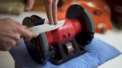 Blade Sharpening on Grinding Machine Stock Footage 129635868