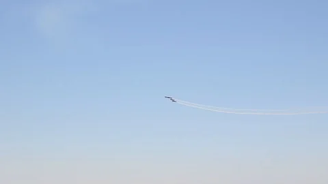 The Blades aerobatic team loop the lop in formation in Extra E-A 300 aircraft Stock Footage 117546433