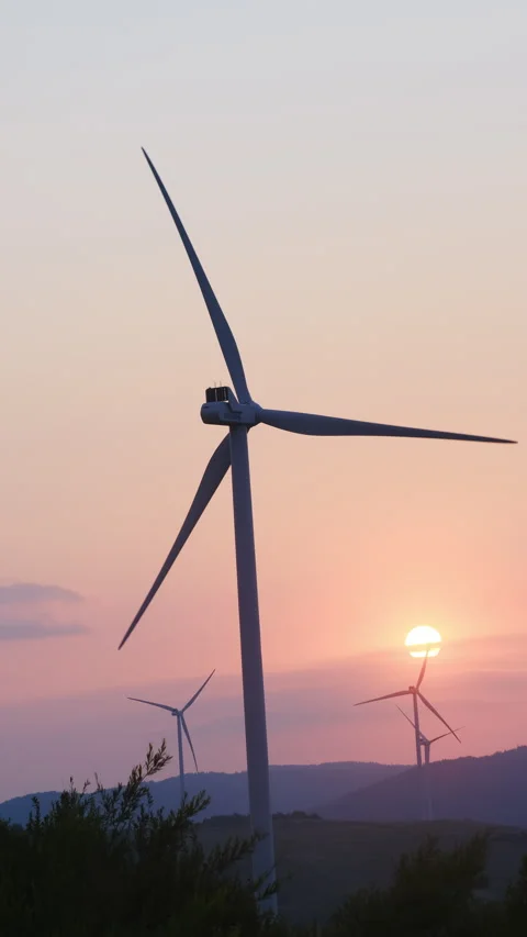 Blades of turbines spin in soft wind and make electricity Video stock 323867145