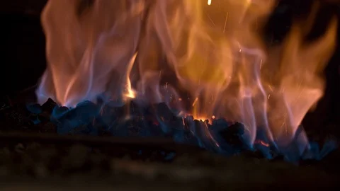Bladesmith and blacksmith work on knives and metal in old anvil in slowmotion Stock Footage 96349573