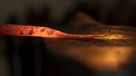 Bladesmith and blacksmith work on knives and metal in old anvil in slowmotion Stock Footage 96350500