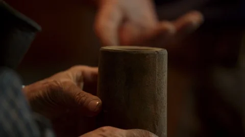 Bladesmith and blacksmith work on knives and metal in old anvil in slowmotion Stock Footage 96351410