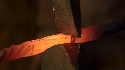 Bladesmith and blacksmith work on knives and metal in old anvil in slowmotion Stock Footage 96351747