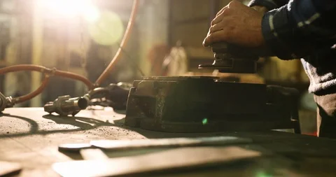 Bladesmith deburring metal with angle grinder Stock Footage 126588583