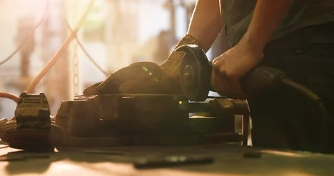 Bladesmith deburring metal with angle grinder Stock Footage 126589227