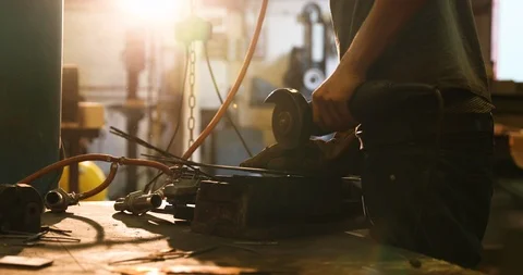 Bladesmith working with angle grinder Stock Footage 126584444