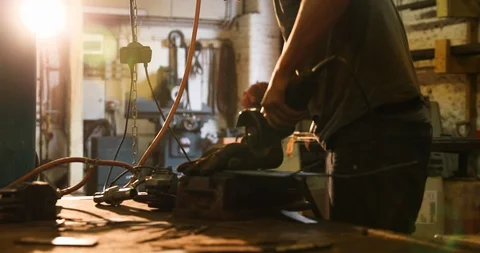 Bladesmith working with angle grinder Stock Footage 126584685