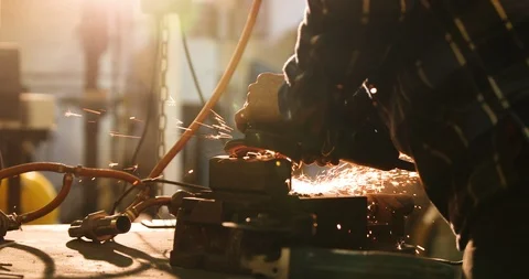 Bladesmith working with angle grinder Stock Footage 126585595