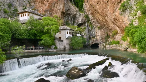 Blagaj Tekija (a Dervish monastery) at the source of the Buna river Stock Footage 205240130