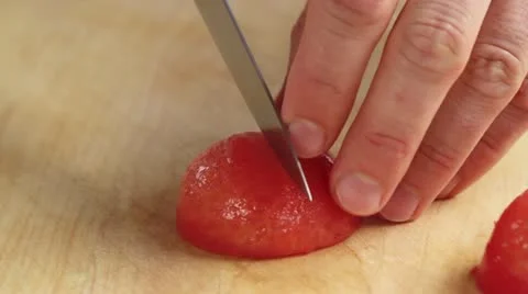 The blanched tomatoes being deseeded Stock-Footage 24673195