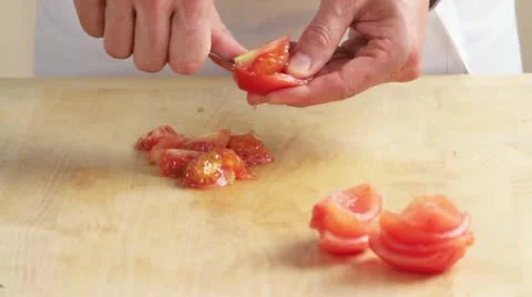 The blanched tomatoes being deseeded Stock Footage 24673196