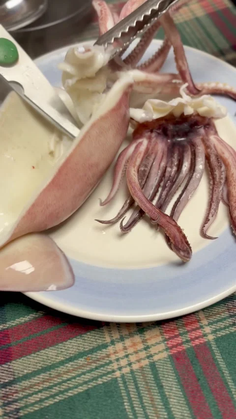 Blanching fresh squid in boiling hot water, close-up shot Video stock 327048372