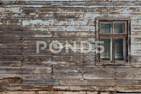Blank ad space on a wooden old wall in the street outside Stock Photos