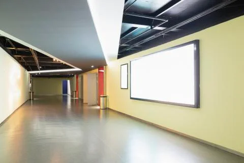 The blank advertisement column on the wall of the corridor Stock Photos