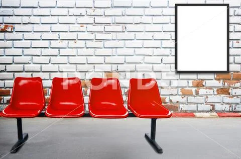 Blank advertising billboard or wide screen television and red chair Stock Photos