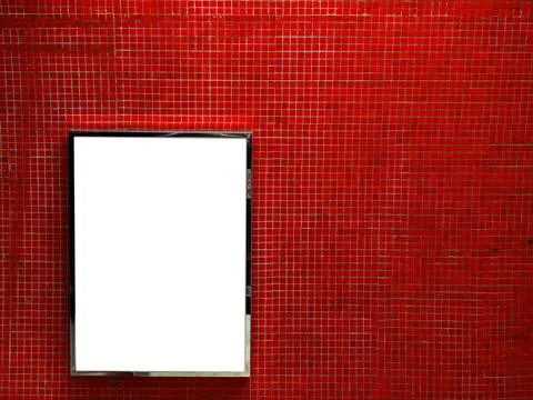 Blank advertising lightbox on red mosaic tile wall in subway station. Urban.. Stock Photos