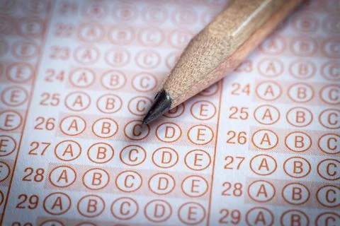Blank answer sheet with pencil close up. Stock photo. Stock Photos