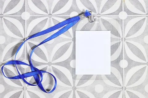 Blank badge mockup. Plain empty name tag mock up on tilestable. Name tag with gr Stock Photos