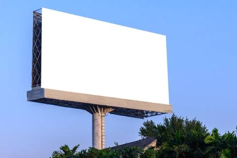 Blank billboard against blue sky for advertisement. Stock Photos