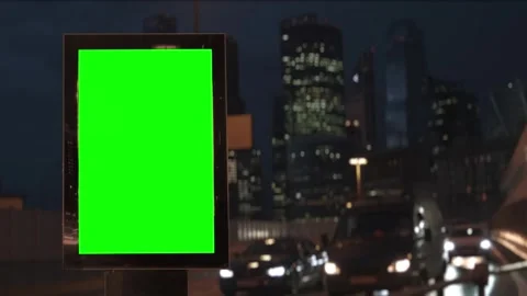Blank billboard with green screen on a busy city street at night Stock Footage 346076077