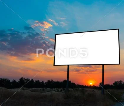 Blank Billboard Ready For New Advertisement With Sunset Background.