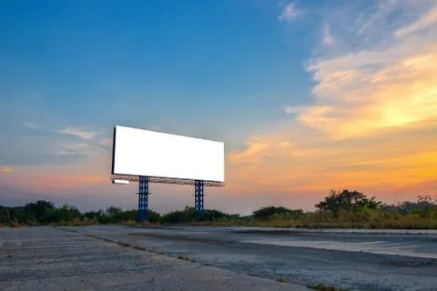 Blank billboard with sky at sunset ready for new advertisement. Stock Photos