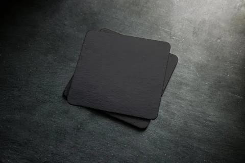 Blank black beer coaster stack mock up, top view Stock Photos