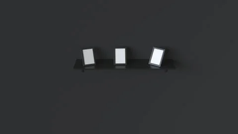Blank black photo frames standing on shelf Stock Illustration