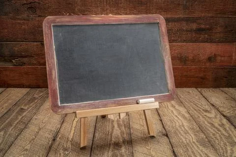 Blank  blackboard sign on rustic wood Stock Photos