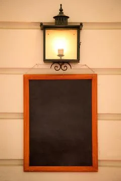 Blank blackboard on a wall background Stock Photos
