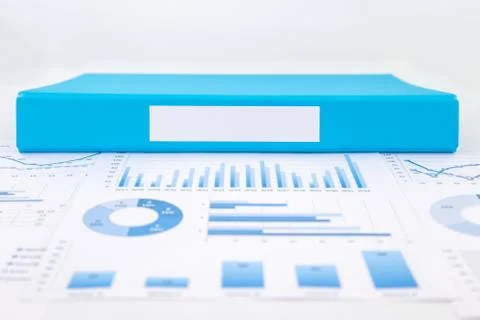 Blank blue folder with analytic graph and business reports Stock Photos