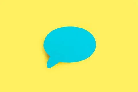 Blank blue speech bubble with copy space on a yellow background Stock Photos
