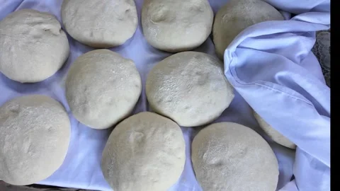 A blank for bread made of dough lies on the table Stock Footage 288244718