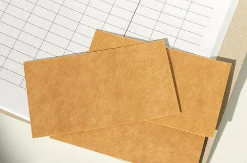 Blank brown cards on open spreadsheet indoors Foto stock