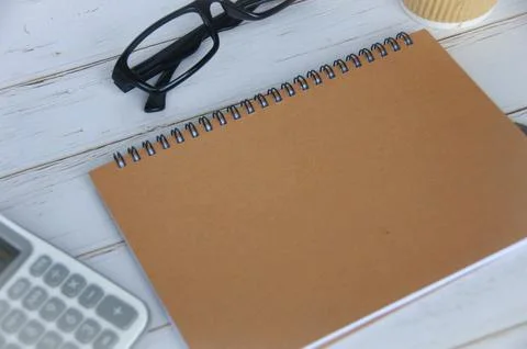 Blank brown notepad with space customizable for text or ideas. Stock Photos
