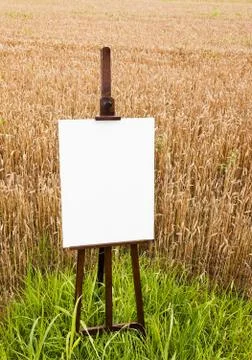 Blank canvas on an easel Stock Photos